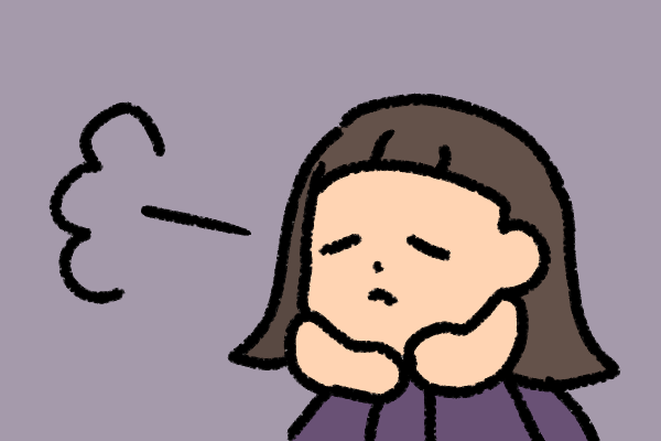 上手くいかずため息をつく人